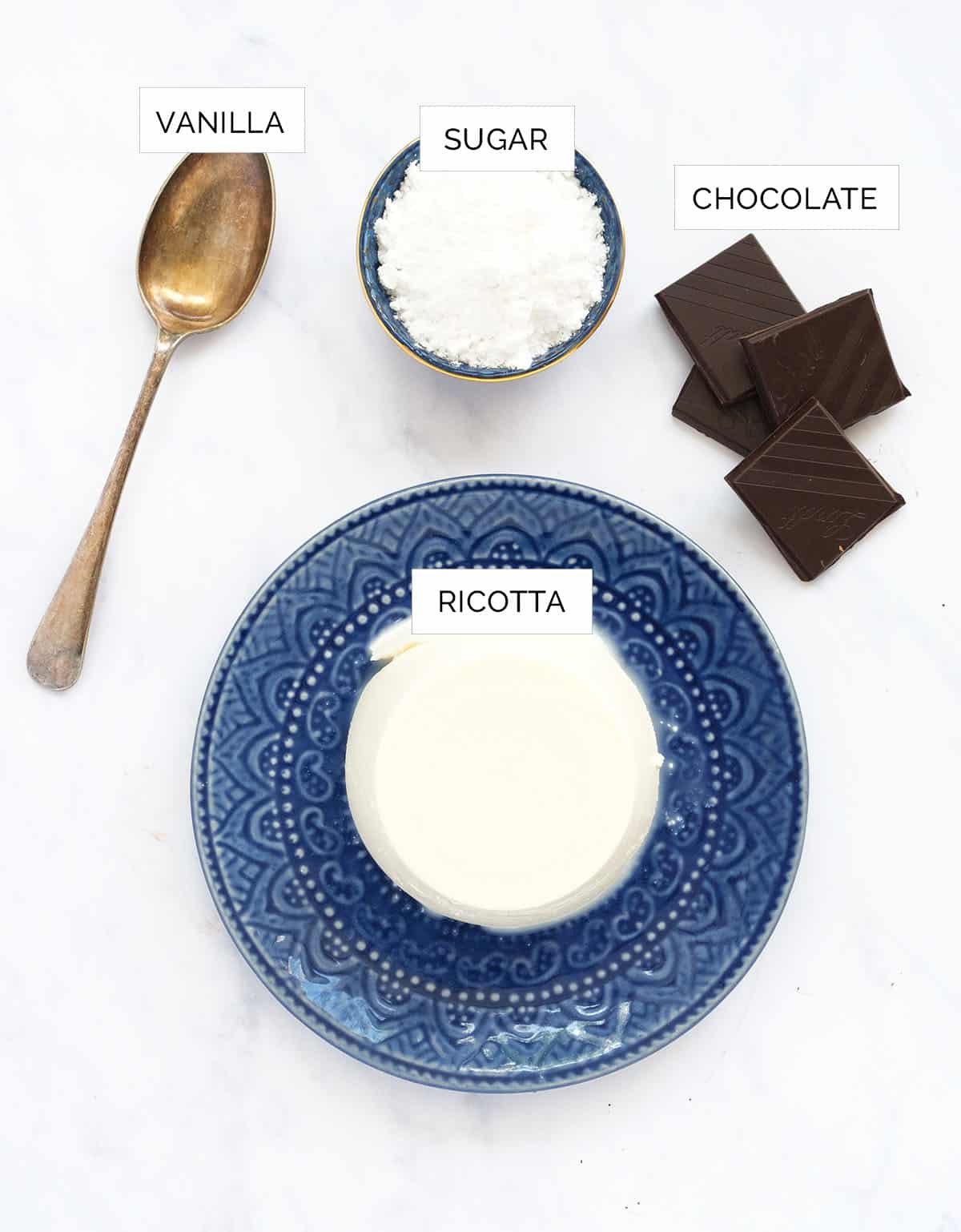 The ingredients to make the ricotta cream are arranged over a white background.