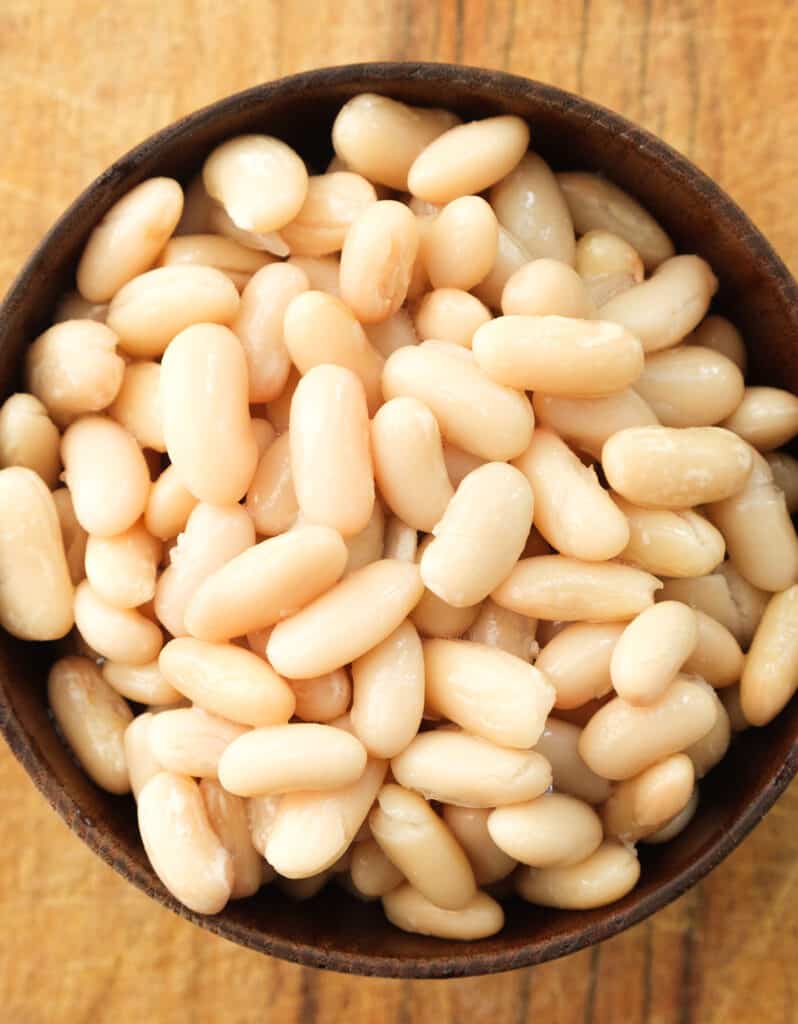 Top view of a bowl full of cannellini beans.