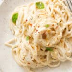 Top view of a plate full of creamy ricotta spaghetti.