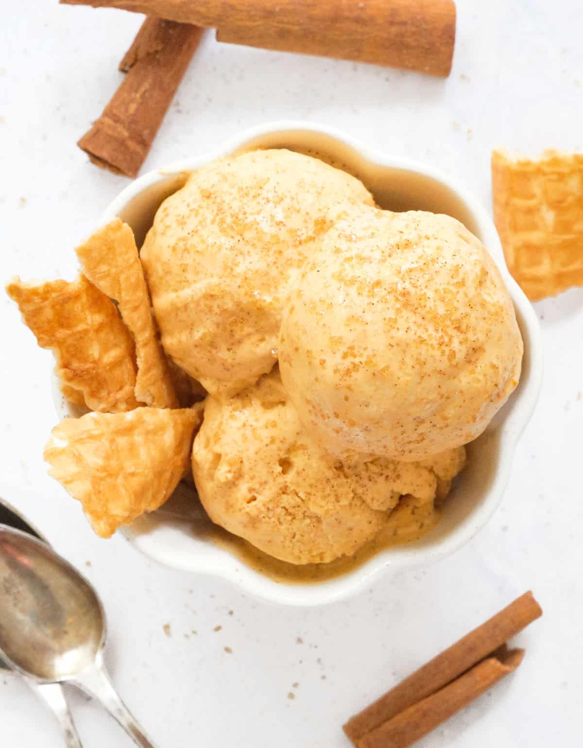 Top view of pumpkin ice cream served in a white bowl.