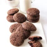 A few cocoa cookies over a white background.