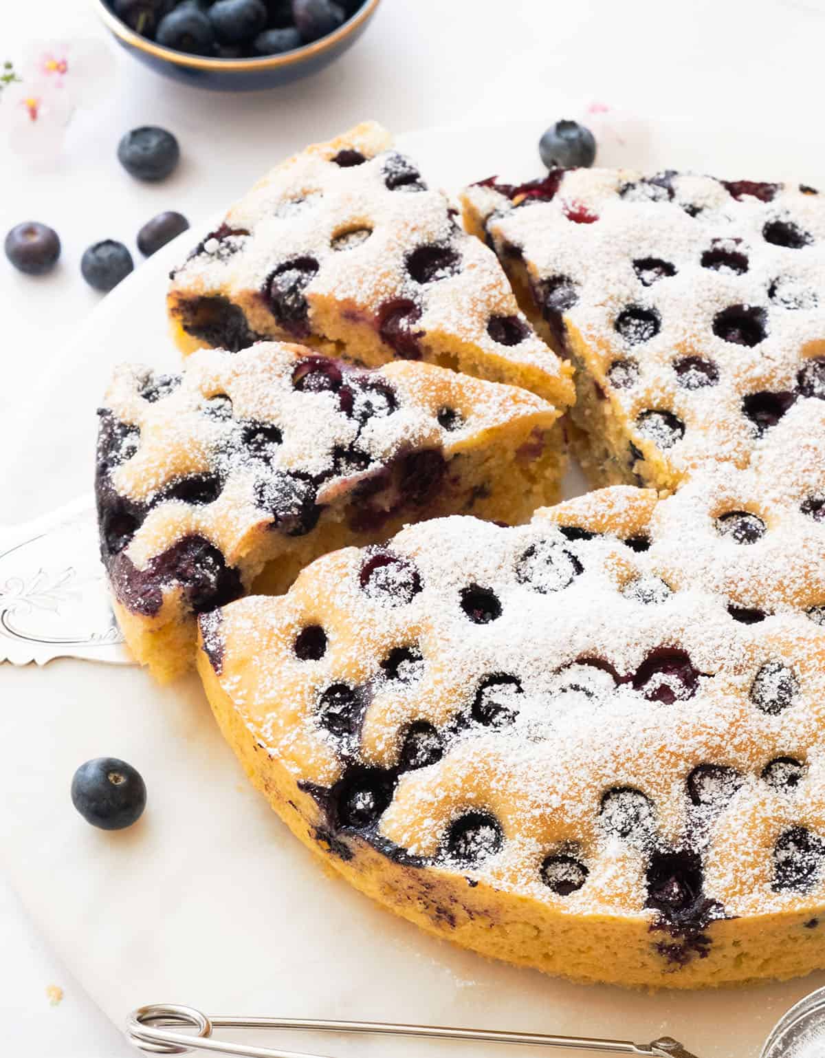 Ricotta blueberry cake cut into slices.