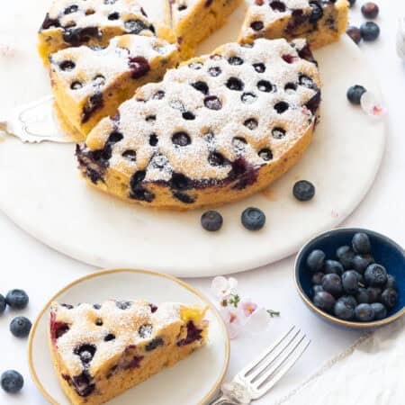 Ricotta blueberry cake on a white background.