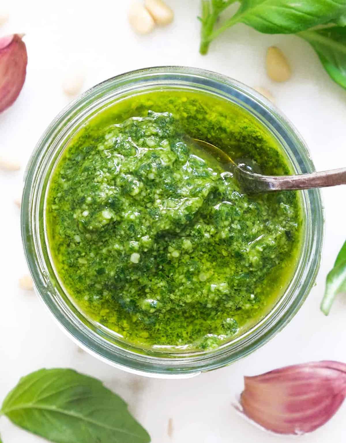 Top view of a glass jar full of pesto alla Genovese.
