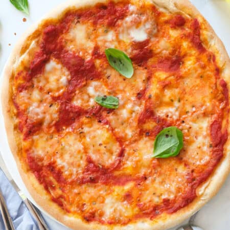 Top view of a round pizza made with a stand mixer pizza dough.