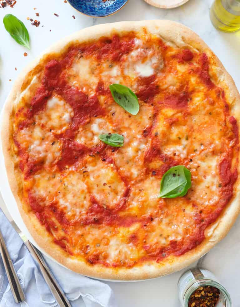 Top view of a round pizza made with a stand mixer pizza dough.