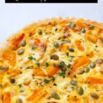 Pumpkin Quiche over a white background.