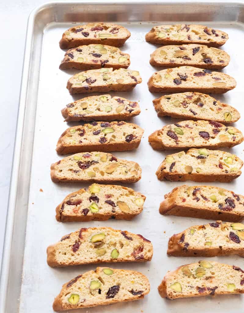 Cranberry pistachio biscotti cut into slices after baking.