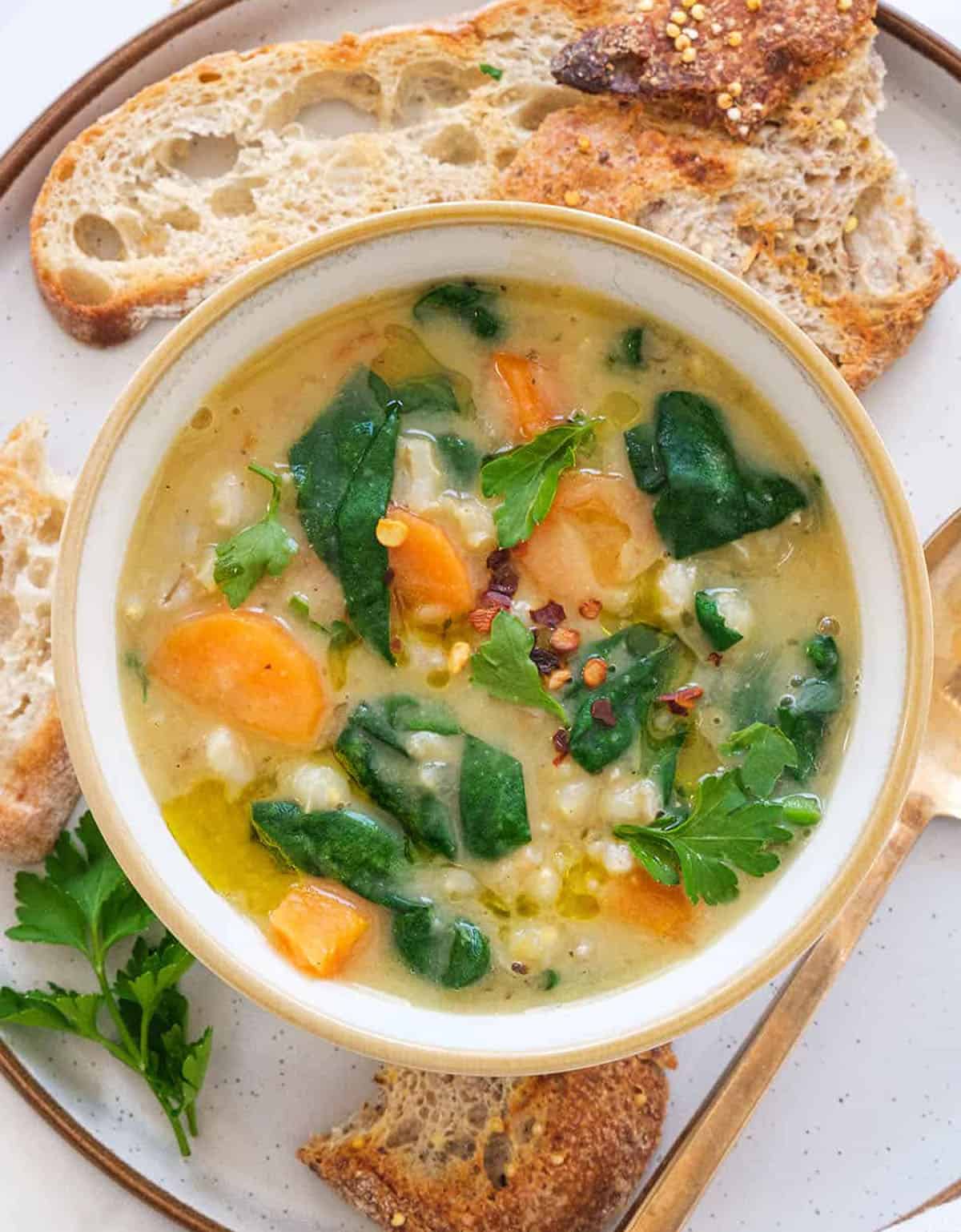 Top view of one of the low-calorie soup recipes made with barley and veggies.