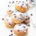Ricotta chocolate chip cookies over a white background.