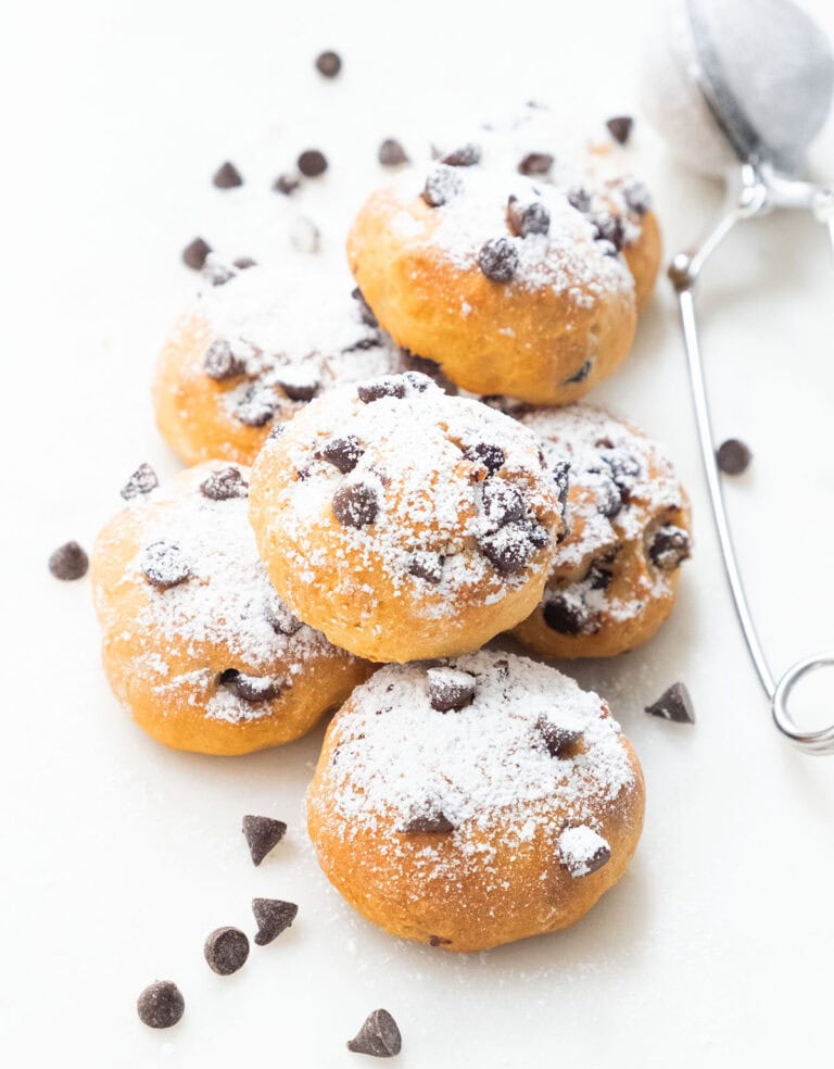 Ricotta chocolate chip cookies over a white background.
