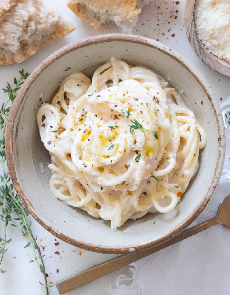 Top view of a bowl full of creamy goat cheese pasta.