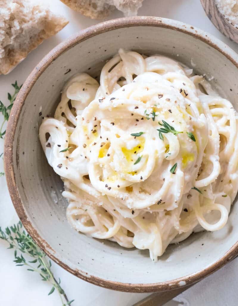Top view of a bowl full of creamy goat cheese pasta.